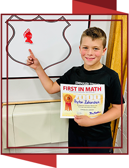 Proud student holding first in math award certificate